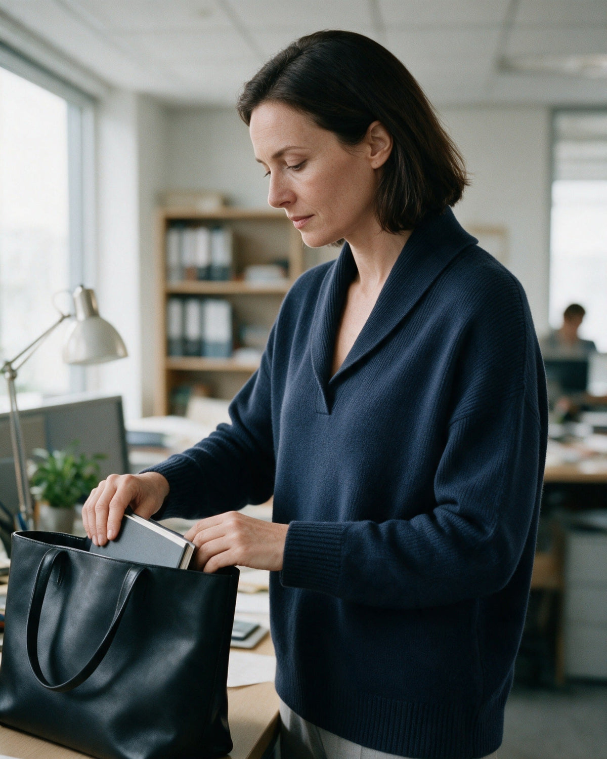 Arden shawl-collar sweater in Navy, worn at the office