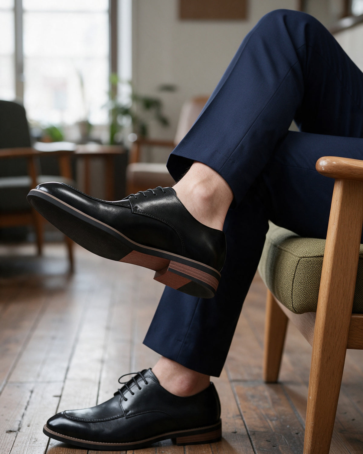 Calder derby shoes in black worn seated