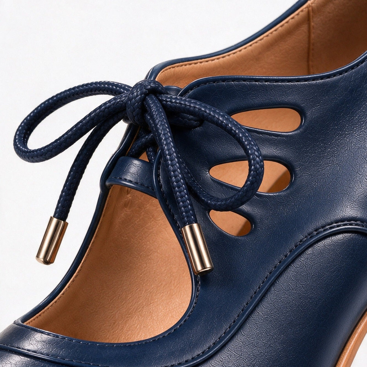Ellery lace bow and teardrop cutouts, close-up