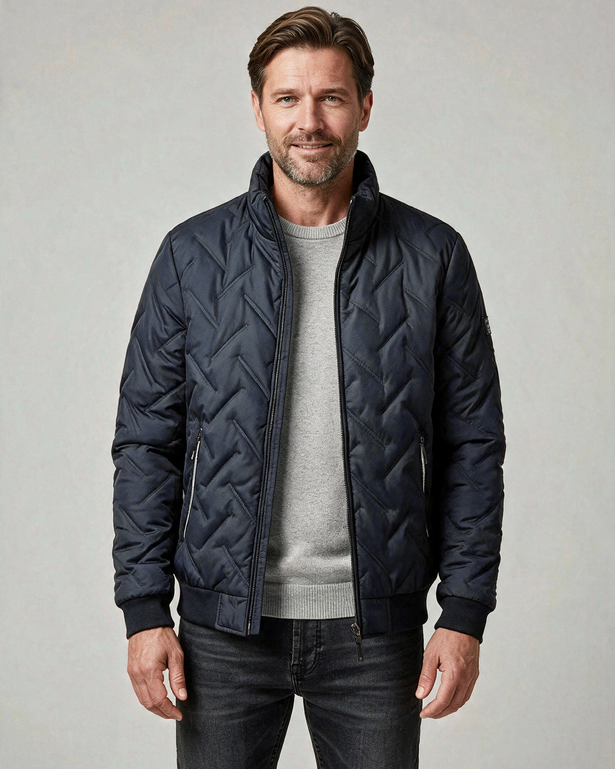 Lars quilted bomber jacket in navy blue, front view